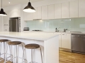 White contemporary kitchen with island